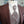 Charger l&#39;image dans la galerie, détail d&#39;un costume de marié bordeaux veste  uni bordeaux gilet à motifs floraux gris clair et bordeaux cravate assortie au gilet
